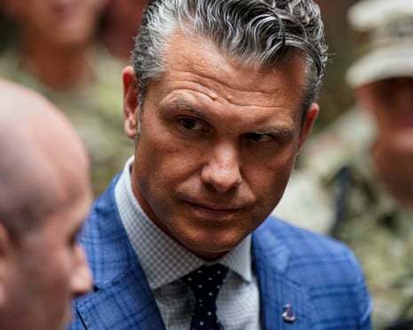 close up of a man in a suit looking at another man