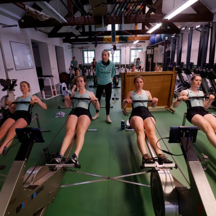 Hannah Murphy, the cox of the women’s blue boat, urges on four of her crew – Gemma King, Megan Lee, Jenna Armstrong and Clare Hole – as they undertake a long session on the ergo machines at the Goldie boathouse, Cambridge.