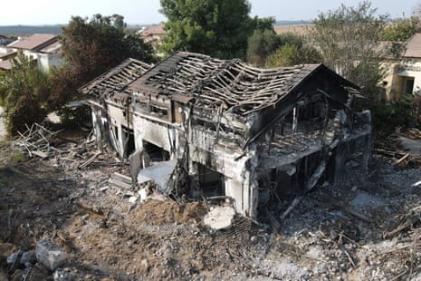 An aerial picture shows a damaged building in kibbutz Beeri near Israel’s border with Gaza on October 22 in the aftermath of the surprise 7 October Hamas attack.