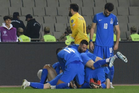 Azerbaijan’s players celebrate a goal in their historic 3-0 win over Sweden.