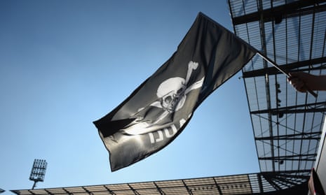 A flag is waved during a St Pauli match at Millerntor Stadium.