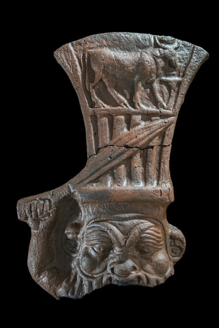 Ceramic depicting the god Bes raising a dagger.