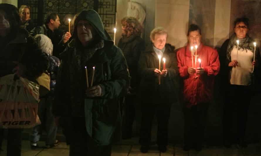 Demonstrators hold lit candles in front of the Acropolis museum in Athens to demand the return of the Parthenon sculptures.