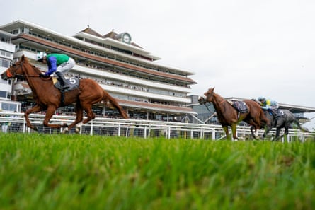 Issac Shelby comes home in front of the riderless Chaldean to win at Newbury