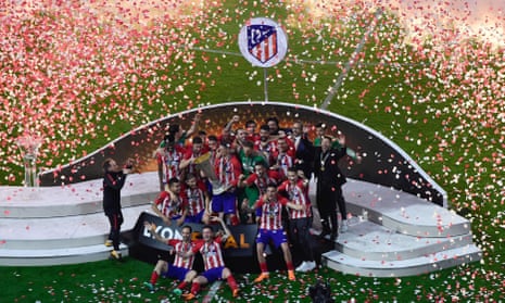 Atletico’s players pose with the trophy after winning the Europa League final.