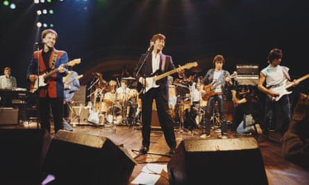 In an all-star lineup at a charity concert for Action into Research for Multiple Sclerosis, at the Royal Albert Hall in 1983: (from left) Steve Winwood (keyboards), Low (standing in front of Jimmy Page), Kenney Jones (drums), Eric Clapton, Charlie Watts (drums), Bill Wyman and Jeff Beck.