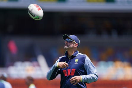 Nathan Lyon throws a rugby ball on day one of the second Ashes Test, having been told he was not in the XI for Australia.