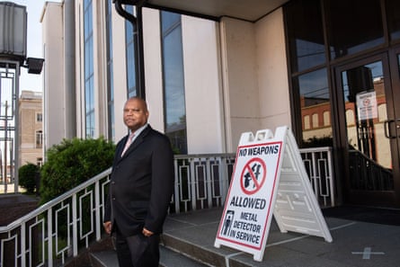 Michael Jackson, the Hale county district attorney, stands outside a courthouse in Alabama.