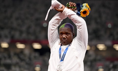Raven Saunders gestures on the podium after winning silver in the women’s shot-put at the Tokyo Olympics.