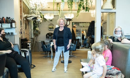 Natalie Power, owner of Dylan Robert Hair and Beauty, at her shop with her daughter, two grandchildren and staff.