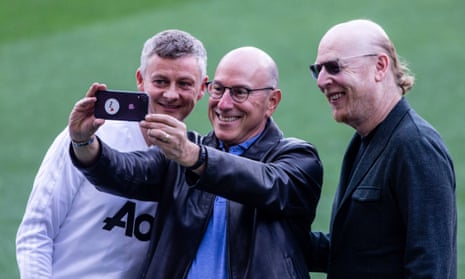 Ole Gunnar Solskjær takes a selfie with Joel Glazer (centre) and Avram Glazer (right) in April 2019.