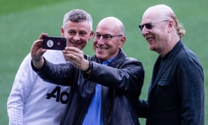 Manchester United’s Joel Glazer with his brother Avram and Ole Gunnar Solskjær