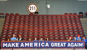 Supporters watch an address by Republican presidential candidate Donald Trump during a campaign rally in Cincinnati