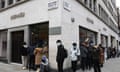 People queue outside the Hermes store in Mayfair in London, Monday, April 12, 2021.