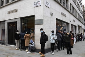 People queue outside a Hermes store in Mayfair in London, Monday, on 12 April, 2021.