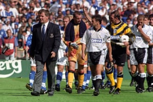 Ahead of the start of the 1995 Charity Shield, Everton manager Joe Royle, left, leads out the Everton team with captain Barry Horne, followed by goalkeepers Tim Flowers and Neville Southall behind.