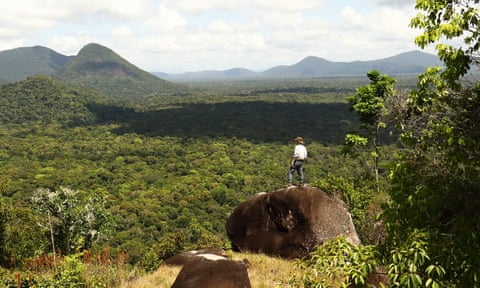 Kevin Rushby looking from Awarmie Hill over the jungles of Rewa, Guyana