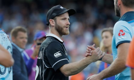 Kane Williamson congratulates England players. ‘He’s an unbelievable guy,’ says Eoin Morgan, who went for a drink in the New Zealand dressing room after the game.