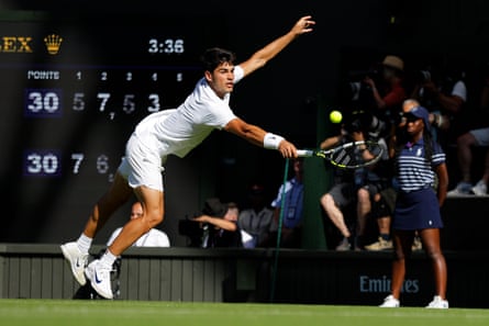 Spain's Carlos Alcaraz stretches for a backhand return.