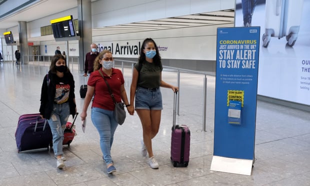 Passengers on a flight from Madrid arrive at Heathrow airport on Sunday. 