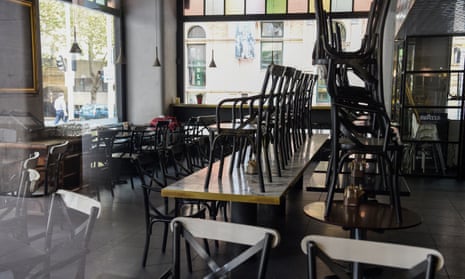 Stacked tables and chairs in a closed cafe in Sydney, Australia