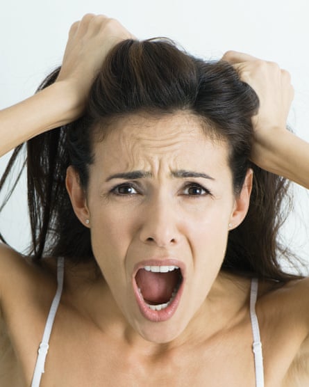 a woman pulling her hair in frustration