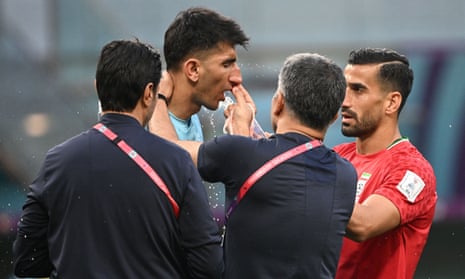 Alireza Beiranvand receives treatment in the first half of Iran’s game against England.