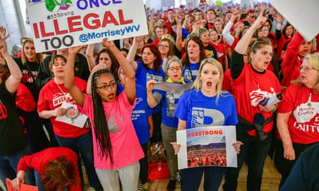 West Virginia teachers hold a rally outside the senate chambers in Charleston last month. Strike leaders from Oklahoma, Arizona and Kentucky have been in contact with their West Virginia peers to learn lessons.