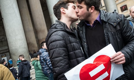 A couple kiss during an LGBT civil rights