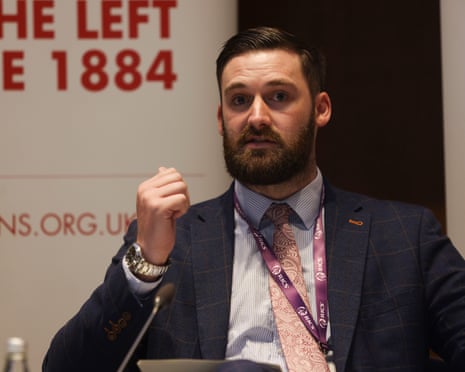 Matthew Torbitt gestures as he speaks at an event