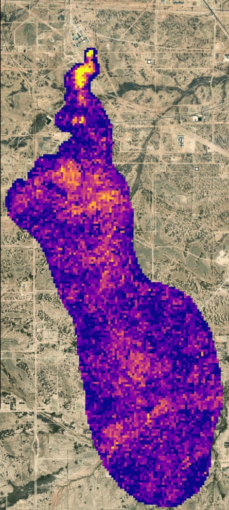 A satellite image of a rural area with a large purple and pink pixellated area indicating a plume of methane emissions