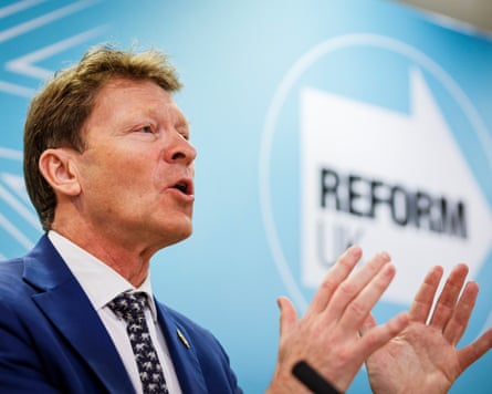 Richard Tice speaking in front of a Reform board