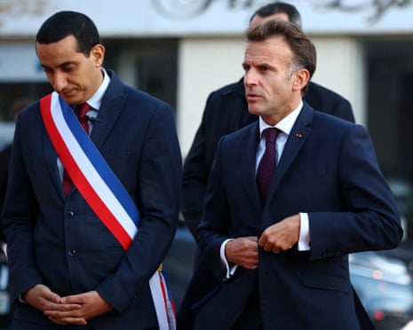 Emmanuel Macron arrives for a meeting at Trappes town hall with mayor Ali Rabeh on Friday after a racist shooting in the Parisian suburb left one person dead and several others wounded.