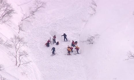 Japan avalanche: two New Zealand skiers killed and one rescued – video