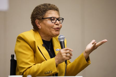 An older woman speaks into a microphone.