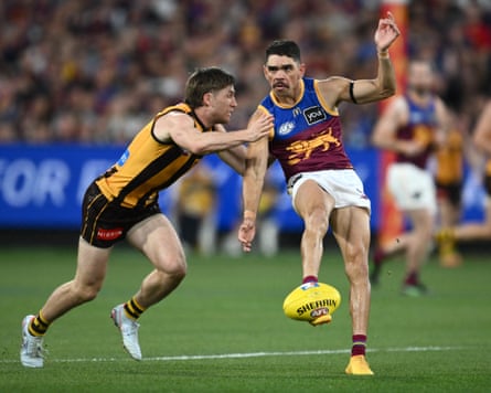 Dylan Moore of the Hawks tackles Charlie Cameron of the Lions during the AFL Preliminary Final match at the MCG.