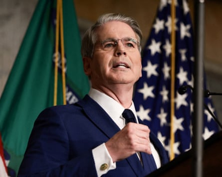 Scott Bessent giving a speech in front of a US flag