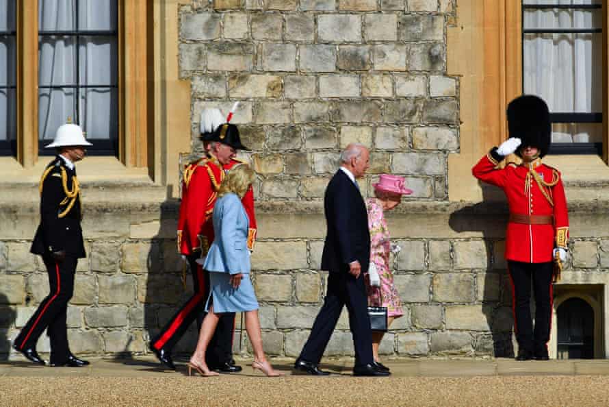 The Bidens walk next to the Queen at Windsor Castle.