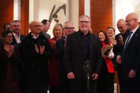 Starmer speaking to members of a business delegation during his visit to China.