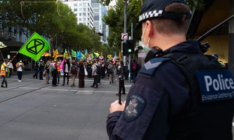 Police observe a climate protest in Melbourne