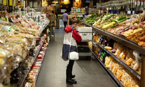 People shop at a supermarket in Sydney, Australia