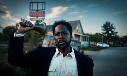Harold Perrineau holding a bell, in From