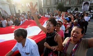 Protesters march in Lima after the president, Pedro Pablo Kuczynski, pardoned his predecessor Alberto Fujimori.