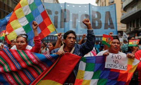 People take part in a demonstration in support of Evo Morales