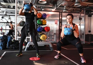 Weightlifters lift kettlebell weights