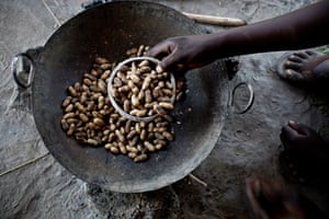 Helena cooks a meal of groundnut