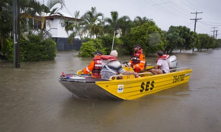 SES volunteers are seen rescuing residents in Rosslea, Townsville