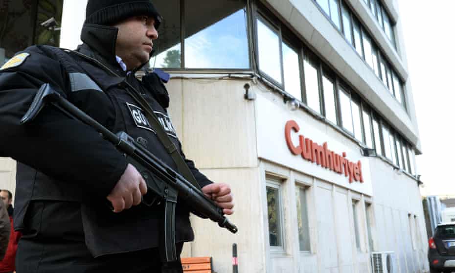 A police officer outside Cumhuriyet, whose editor-in-chief was sentenced to prison in May.