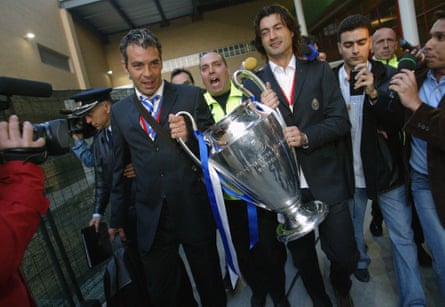 Jorge Costa (left) and Vitor Baia arrive at Porto airport with the Champions League trophy