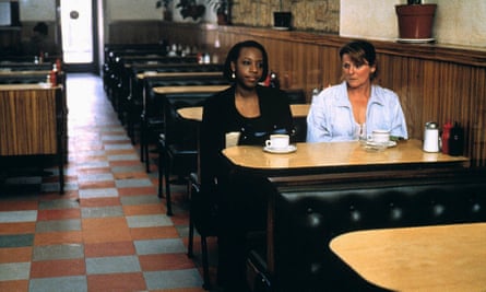 Jean-Baptiste sitting in a cafe with Brenda Blethyn in Secrets & Lies